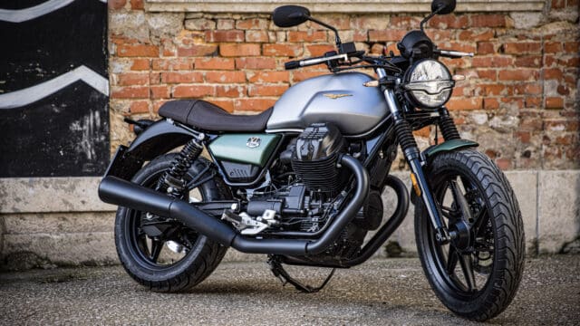 Moto Guzzi V7 Stone Classic Motorcycle Parked Against Brick Wall Wallpaper