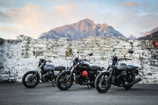 Moto Guzzi V7 Wallpapers Featuring Three Classic Motorcycles Against Mountain Background