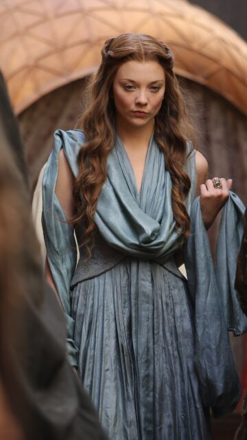 Natalie Dormer In A Blue Medieval Dress, Natalie Dormer Wears A Detailed Blue Medieval Gown With Long Wavy Hair In A Serious Expression, 2K Mobile Wallpaper