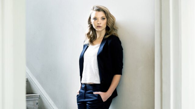 Natalie Dormer Standing Near A Wall, Natalie Dormer Is Standing With Her Hands In Pockets Against A Light Colored Wall Looking Directly At The Camera, 4K Desktop Wallpaper