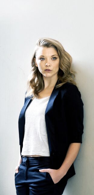 Natalie Dormer Stylish Portrait, Natalie Dormer Poses Confidently With Hands In Pockets Against A Plain Background, 2K Mobile Wallpaper