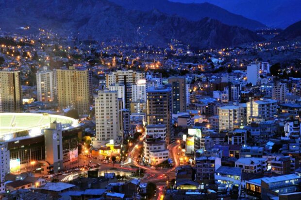 The night view of Bolivia cityscape shows illuminated buildings and winding streets, HD Desktop Wallpaper