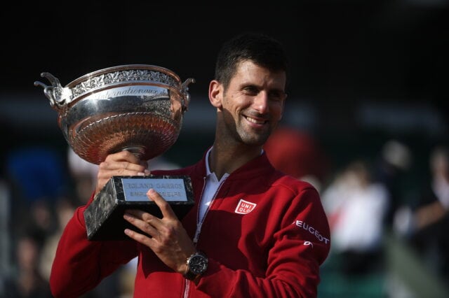 Novak Djokovic Celebrates French Open Victory Trophy Wallpaper