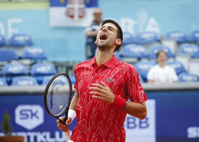 Novak Djokovic Celebrates On Tennis Court Wallpaper