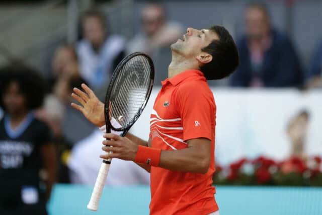 Novak Djokovic Tennis Match Intensity Wallpaper