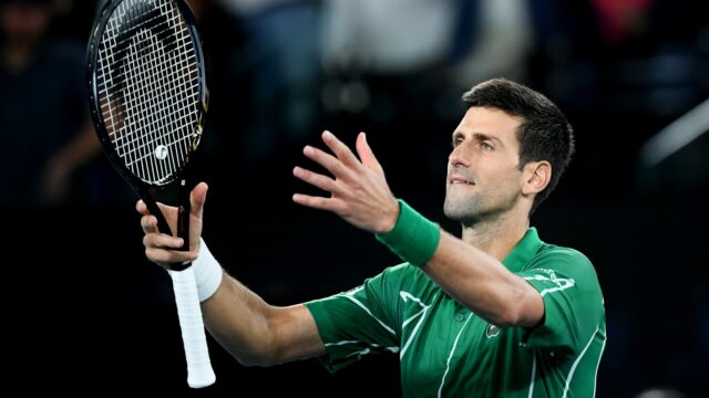 Novak Djokovic In Action Tennis Wallpaper Featuring Green Outfit