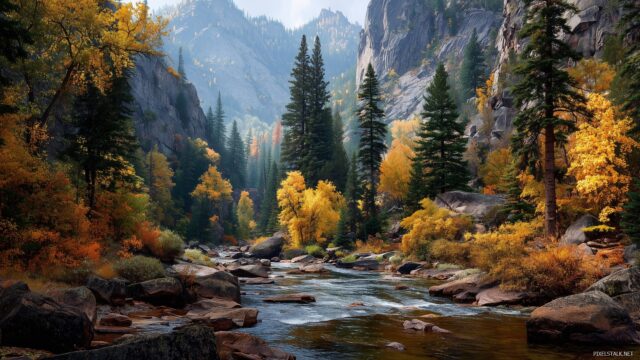 October Wallpaper HD For Desktop, A Picturesque Mountain Landscape During Autumn With A River Flowing Through Colorful Trees