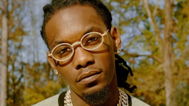 Offset Rapper Close Up Portrait with Diamond Glasses and Chains in Nature Background Wallpaper