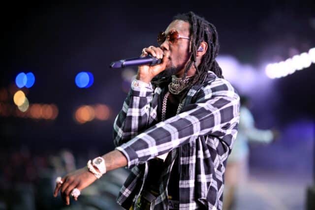 Offset Rapper Performing Live on Stage in Stylish Plaid Shirt and Sunglasses Wallpaper