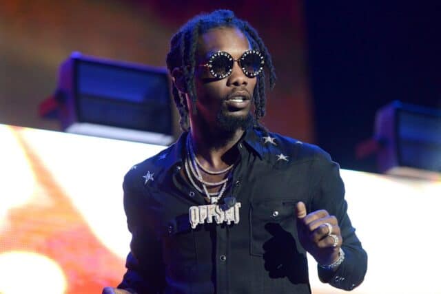 Offset Rapper Performing on Stage Wearing Black Shirt and Sunglasses Wallpaper