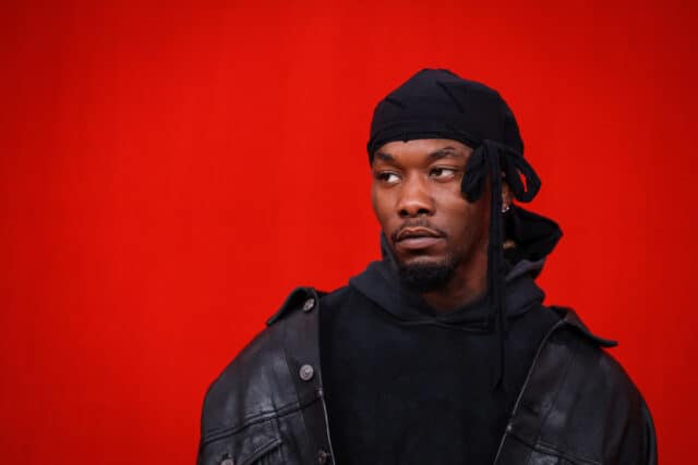 Offset Rapper Stylish Portrait on Red Background for High Quality Wallpapers