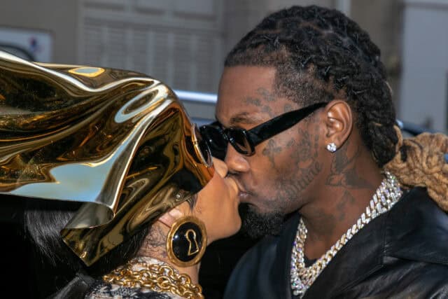 Offset Rapper and Woman Sharing a Kiss with Luxury Accessories Stylish Wallpaper