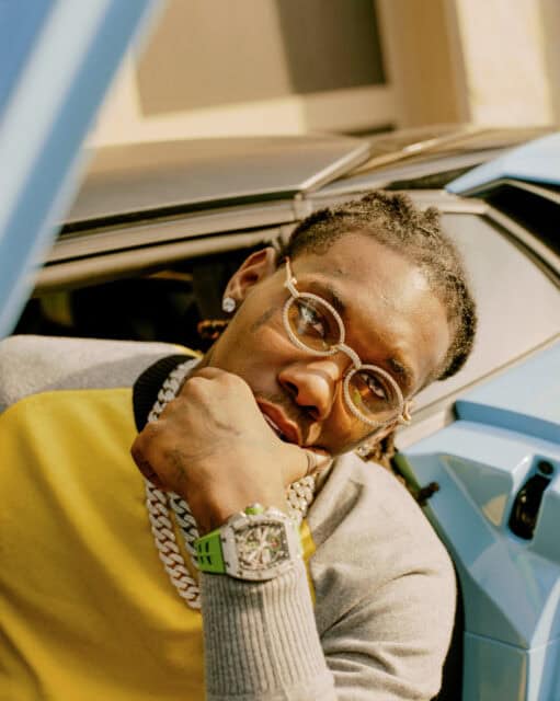 Offset rapper close up portrait luxury watch and chains stylish wallpaper background