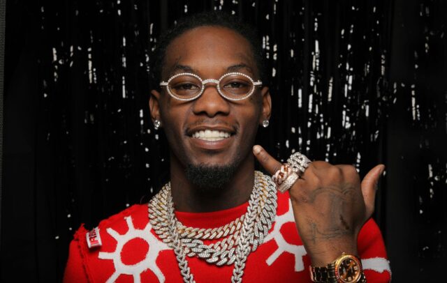 Offset rapper portrait with diamond chains and stylish glasses wallpaper
