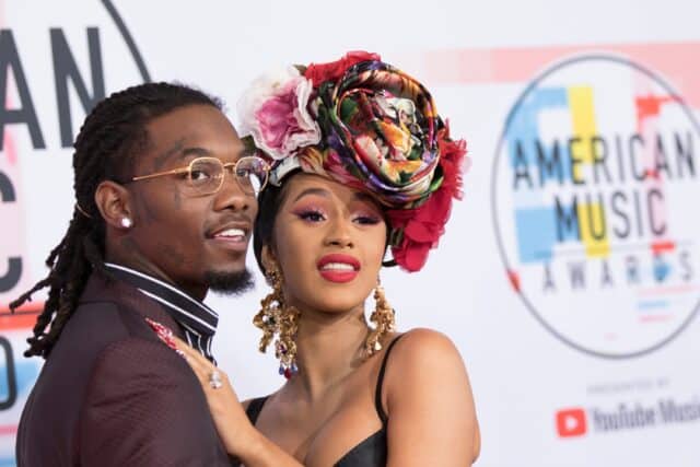 Offset rapper with vibrant floral headpiece at American Music Awards red carpet
