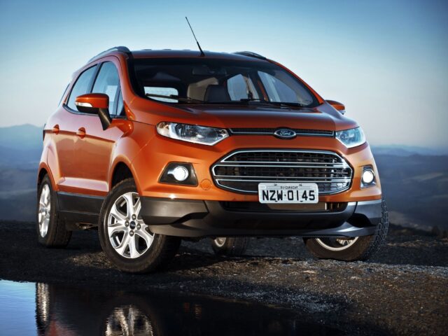 Orange Ford EcoSport On Scenic Road Wallpaper