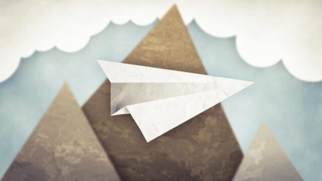 Paper Airplane Adventure Over Mountains Wallpaper