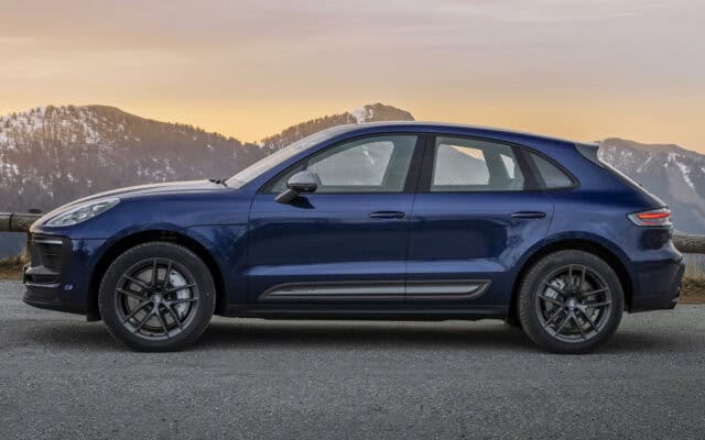 Porsche Macan T side view with mountain sunset background high resolution wallpaper