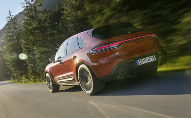 Porsche Macan driving fast on forest road high quality wallpaper
