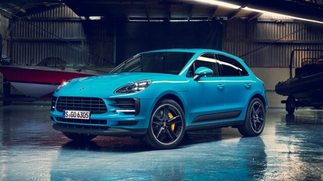 Porsche Macan in Vibrant Blue Parked in Industrial Garage High Quality Wallpapers