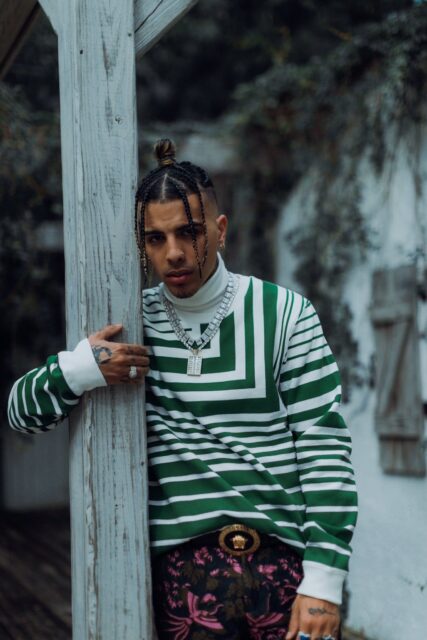 Rauw Alejandro Stylish Green Striped Outfit Wallpaper
