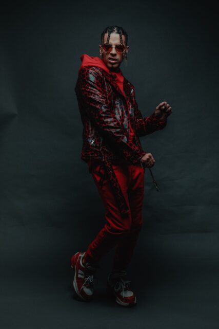 Rauw Alejandro Stylish Pose Wallpaper Collection
