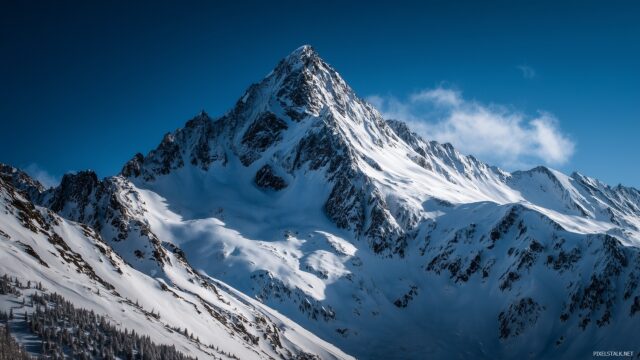 Really Cool Desktop Wallpaper HD Free Download, A Breathtaking View Of A Snowy Mountain Peak Under A Bright Blue Sky, Ideal For A Winter Vibe