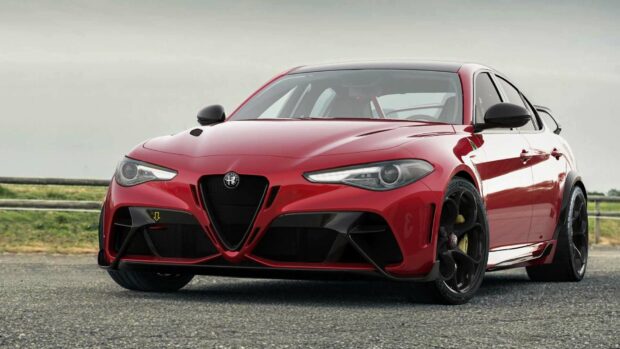 A red Alfa Romeo sports car is parked on an asphalt road with a grassy background, HD Desktop Wallpaper
