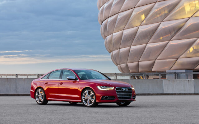 Red Audi S6 Parked In Urban Setting With Modern Architectural Background Audi S6 Wallpapers
