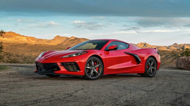 Red Chevrolet Corvette C8 Sports Car Parked With Mountain Background Wallpaper