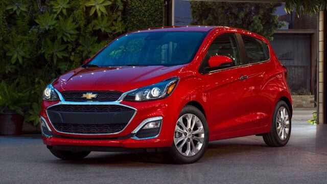 Red Chevrolet Spark Parked Elegantly For Wallpapers