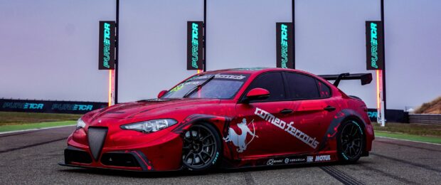 A red Alfa Romeo race car is parked on the racetrack with sponsor logos and a backdrop of Pure TCR banners, 2K Desktop Wallpaper