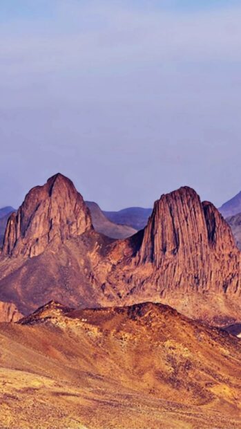 The image shows unique rock formations in the Algerian desert with a clear sky, HD Phone Wallpaper