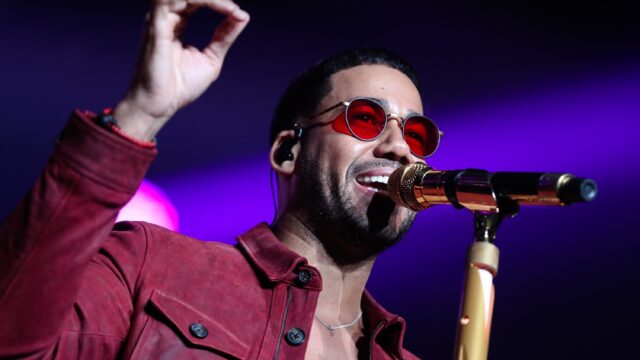 Romeo Santos Live Concert Wallpaper Vibrant Performance Image