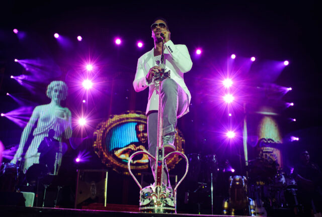 Romeo Santos Live Performance Wallpaper with Vibrant Lights