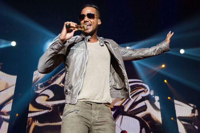 Romeo Santos Performing Live on Stage Wallpaper