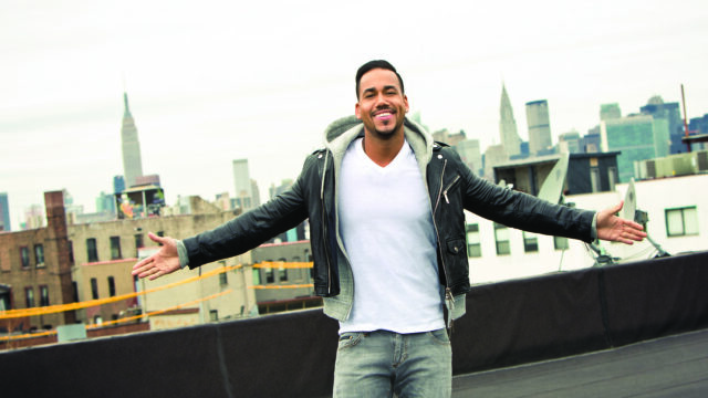 Romeo Santos Smiling on Rooftop Wallpaper for Fans