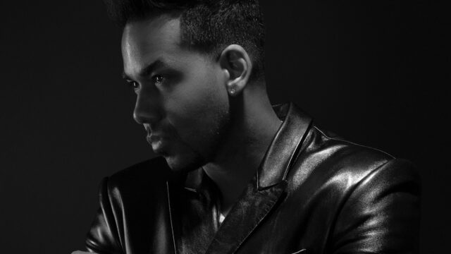 Romeo Santos Stylish Black and White Portrait Wallpaper