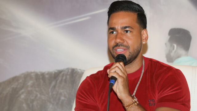 Romeo Santos Wallpaper Vibrant Red Shirt with Microphone