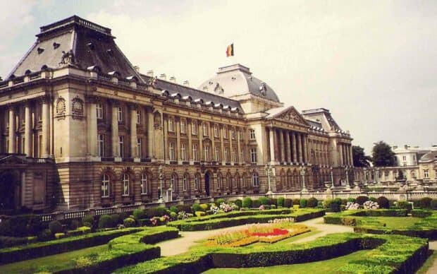 The Royal Palace in Brussels displays classic architecture with a landscaped garden in front under a cloudy sky, HD Desktop Wallpaper