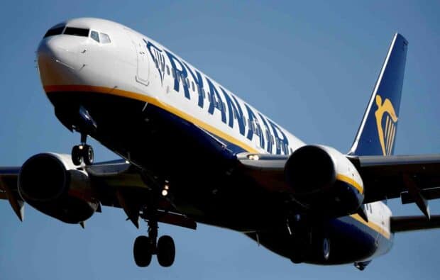 A Ryanair airplane is captured in mid flight during its approach to the runway, HD Desktop Wallpaper