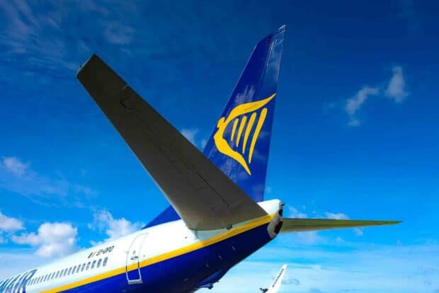 The Ryanair logo is clearly visible on the airplane tail against a blue sky, HD Desktop Wallpaper