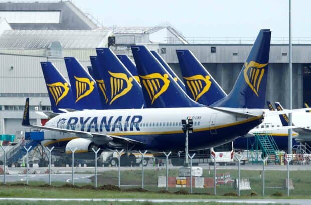 Several Ryanair planes are parked at the airport terminal in a row, 2K Desktop Wallpaper