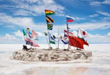 Salar De Uyuni Bolivia Flags Display on Salt Flats under Blue Sky Wallpaper