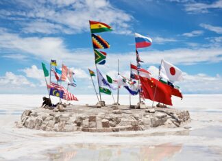 Salar De Uyuni Bolivia Flags Display on Salt Flats under Blue Sky Wallpaper