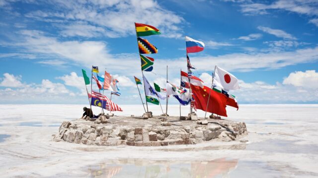 Salar De Uyuni Bolivia Flags Display on Salt Flats under Blue Sky Wallpaper