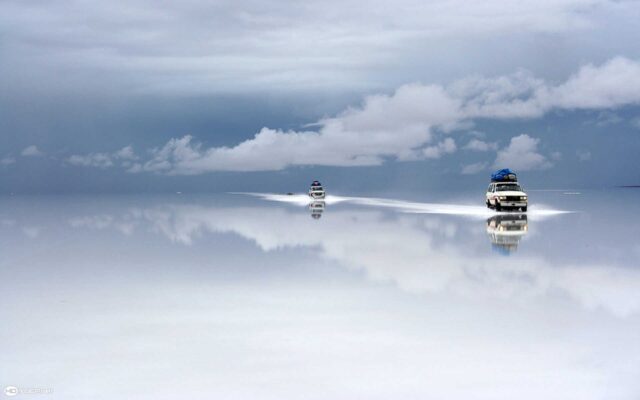 Salar De Uyuni Bolivia Stunning Mirror Effect Landscape With Offroad Vehicles