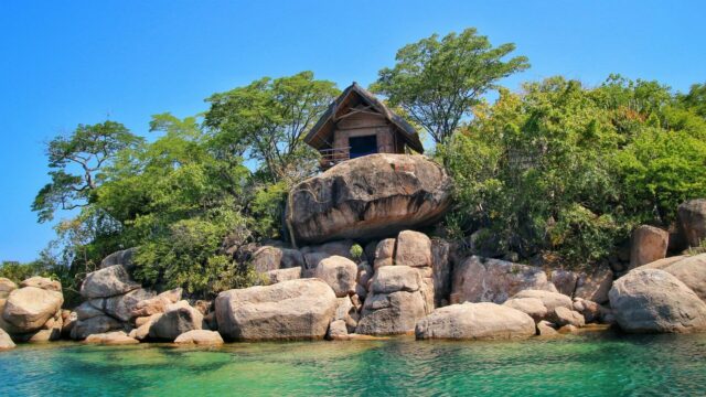 Scenic Lake Malawi Shoreline With Rustic Cabin View