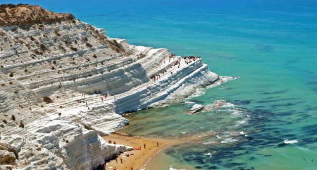 Scenic View of Scala dei Turchi Cliffs in Sicily's Azure Waters