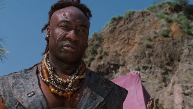 Scorpion King Warrior In Desert Setting Wallpaper